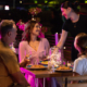 family being served dinner in a footpath dining setting