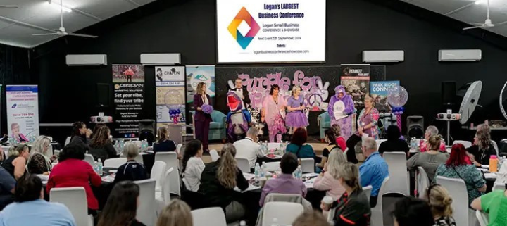 a group of people sitting at a conference