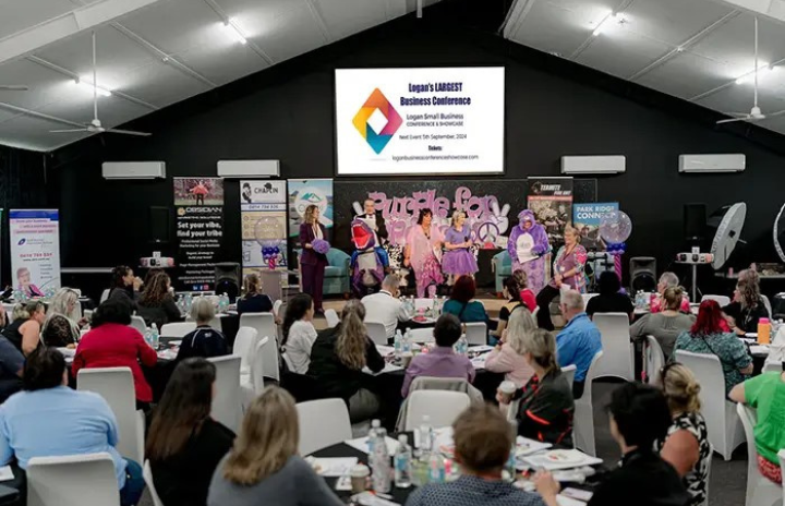 a group of people sitting at a conference