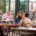 a group of people including people with disabilities dining at Beenleigh Artisan Distillery